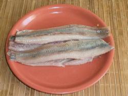 clean herring from the head, bones, fins and skin