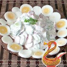 Russian salad of radish and cucumber with egg